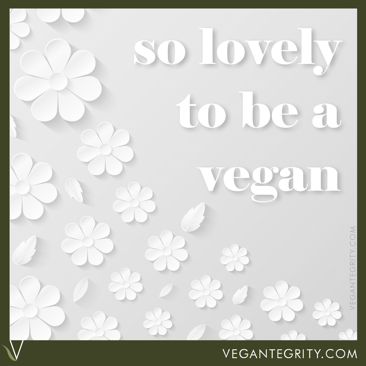 So lovely to be a vegan. Three-dimensional cutout white paper flowers on white paper background.